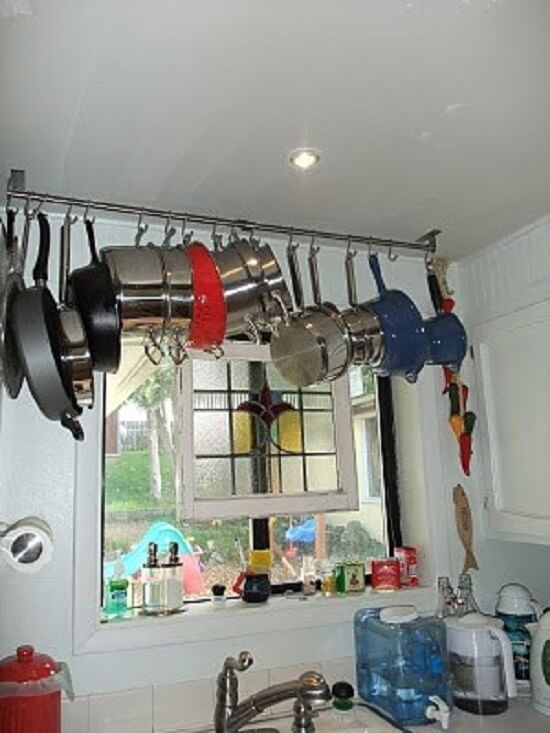 Use a single bar ceiling-mount pot rack. #Kitchen #KitchenOrganization #KitchenDecor #KitchenStorage