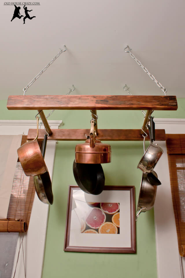 Transform an antique ladder into a pot rack. #Kitchen #KitchenOrganization #KitchenDecor #KitchenStorage