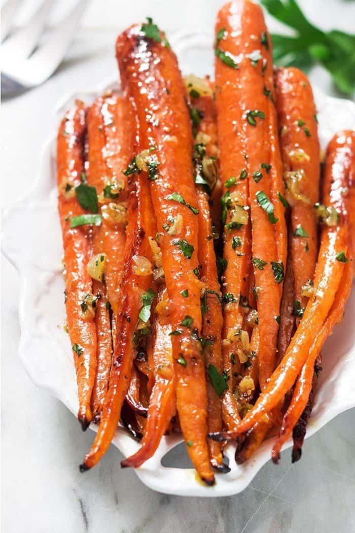 Honey Garlic Butter Roasted Carrots via Eatwell101. Easy, simple, and flavorful Christmas lunch ideas for your families! They're also the perfect meal prep recipes so you can save time during this busy season! Christmas recipes #holidays #recipe #healthymeals. make ahead