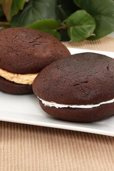 Chocolate Whoopie Pies with Marshmallow Cream get the full recipe on Simple Nourished Living. 50 Quick & Easy Weight Watchers Desserts With SmartPoints. Looking for yummy Weight Watchers desserts with points or freestyle points?These tasty freestyle weight watchers desserts include everything from Cheesecake to chocolate cake to pancakes with cool whip and everything in between! #weightwatchers #weightwatchersdesserts #weightwatchersrecipes #weightwatchersdessertsfreestyle #easy #healthy #smartpoints #wwdesserts #freestyle #desserts #healthydesserts