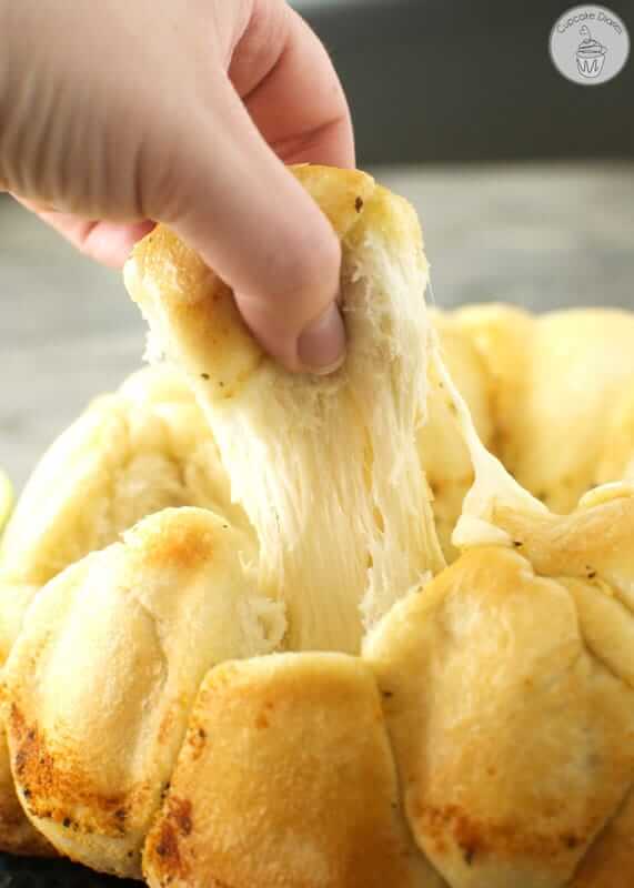 Garlic rolls are stuffed full of mozzarella cheese and baked to golden yumminess.