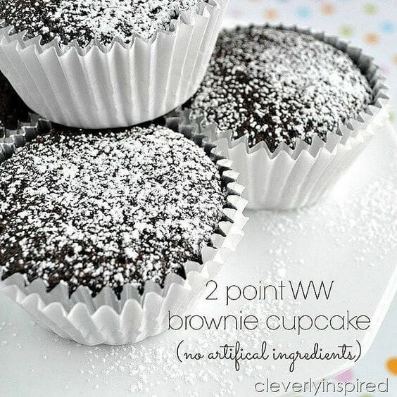 2 Point WW Brownie Cupcakes get the full recipe on Cleverly Inspired. 50 Quick & Easy Weight Watchers Desserts With SmartPoints. Looking for yummy Weight Watchers desserts with points or freestyle points?These tasty freestyle weight watchers desserts include everything from Cheesecake to chocolate cake to pancakes with cool whip and everything in between! #weightwatchers #weightwatchersdesserts #weightwatchersrecipes #weightwatchersdessertsfreestyle #easy #healthy #smartpoints #wwdesserts #freestyle #desserts #healthydesserts