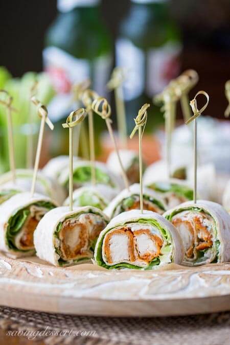 35 Easy Game Day Appetizers Perfect For Super Bowl Party! | Looking for easy game day recipes to wow your football loving friends? We have the best and tastiest collection of finger foods, pin wheel recipes with cream cheese or tortilla roll ups! Serve them as appetizers during game day or take as lunch to work.#superbowl #gameday #pinwheels #rollups #pinwheelrecipes #appetizers #pinwheelappetizers #partyappetizers #fingerfood #footballappetizers