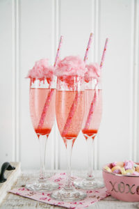 Looking for easy Valentine's Day Cocktails to set the mood? We've put together some of the best pink and red cocktails guaranteed to impress your loved ones!#valentinesday #cocktails #drinks #valentines #partyideas