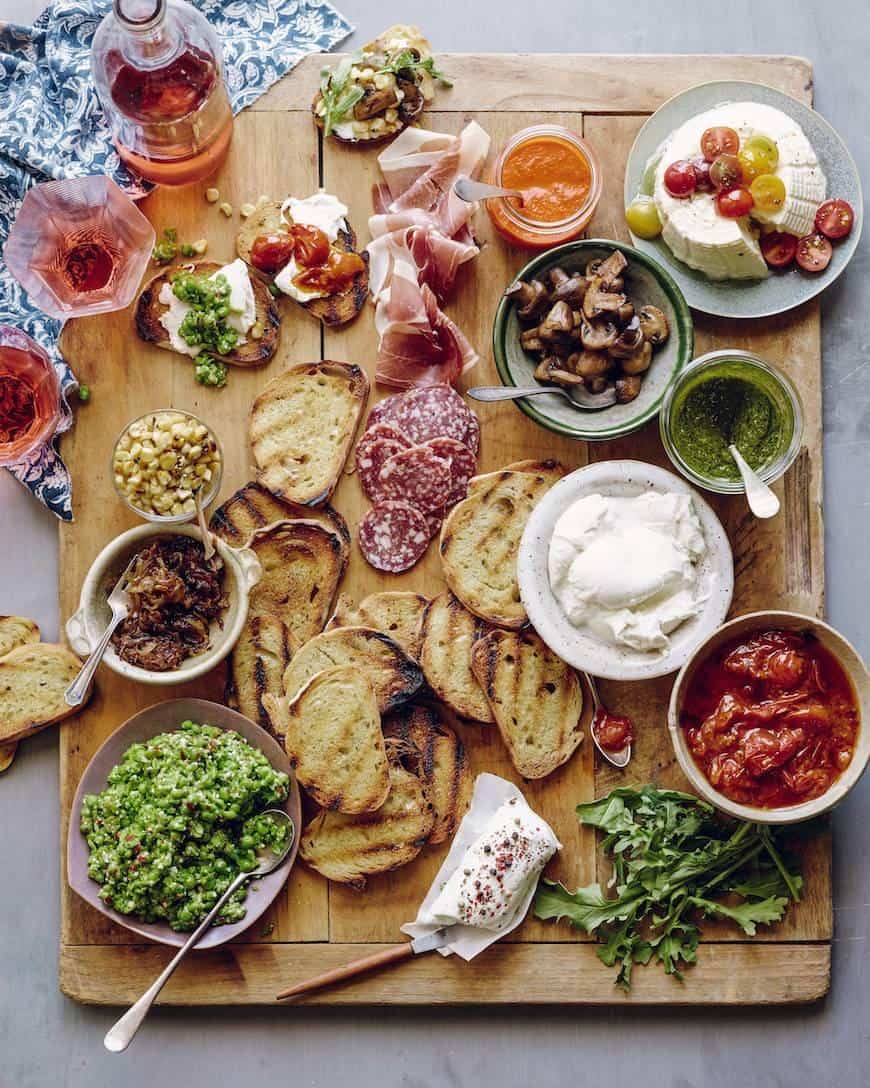 Looking for some amazing charcuterie board ideas to wow your guests on your next holiday parties? Learn how to make a charcuterie board plus get a list of the best cheese boards perfect for a crowd! #appetizers | simple charcuterie board | easy charcuterie board | cheap charcuterie board | food platter | entertaining | fall charcuterie board | thanksgiving charcuterie board | Image via What’s Gabby Cooking
