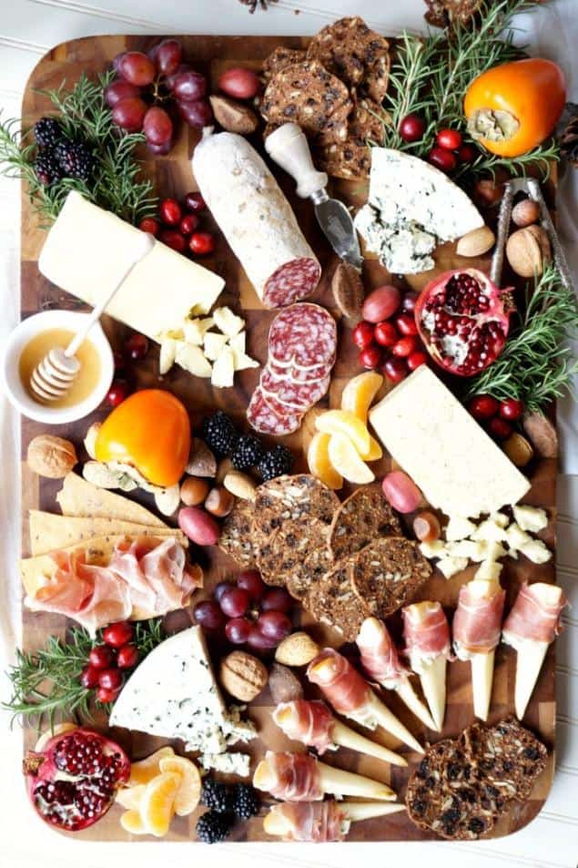 Looking for some amazing charcuterie board ideas to wow your guests on your next holiday parties? Learn how to make a charcuterie board plus get a list of the best cheese boards perfect for a crowd! #appetizers | simple charcuterie board | easy charcuterie board | cheap charcuterie board | food platter | entertaining | fall charcuterie board | thanksgiving charcuterie board | Image via Honest Cooking