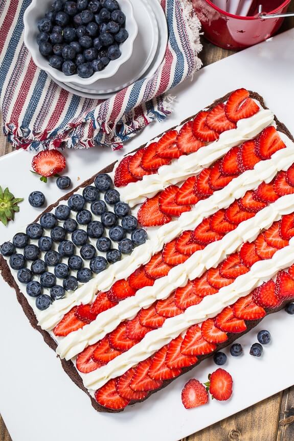 Brownie Flag via Spicy Southern Kitchen. These 22 festive and fun 4th of July party food ideas are guaranteed to impress everyone! They are perfect for a large crowd and even kids and adults will love. Find appetizers, BBQ, desserts, and other red, white and blue recipe ideas here!