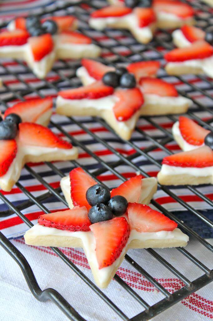 4TH of Start Cookies via The Baker Mama. These 22 festive and fun 4th of July party food ideas are guaranteed to impress everyone! They are perfect for a large crowd and even kids and adults will love. Find appetizers, BBQ, desserts, and other red, white and blue recipe ideas here!