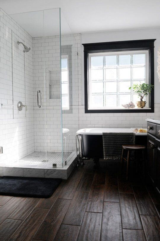with dark wood parquet and white subway tiles