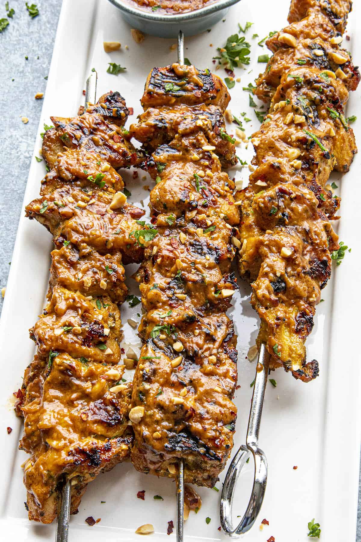 Chicken Satay with Easy Thai Peanut Sauce via Chili Pepper Madness. Level up your summer fun with some of the best BBQ and grilling recipes of all time! If you're looking for some easy + healthy BBQ recipes, grilled chicken or meat for a crowd, we've got you covered. Check out our over 30 summer BBQ recipes for you to try!