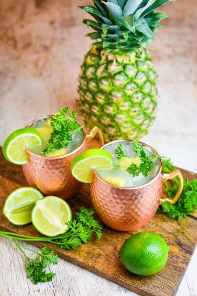 Pineapple Coconut Moscow Mule get the full recipe on Dude That Cookz. These easy cocktail recipes are a refreshing treat to beat the heat this summer! Find mojito recipes, lemonade cocktails, Hawaiian mimosas, tequilas, and more!