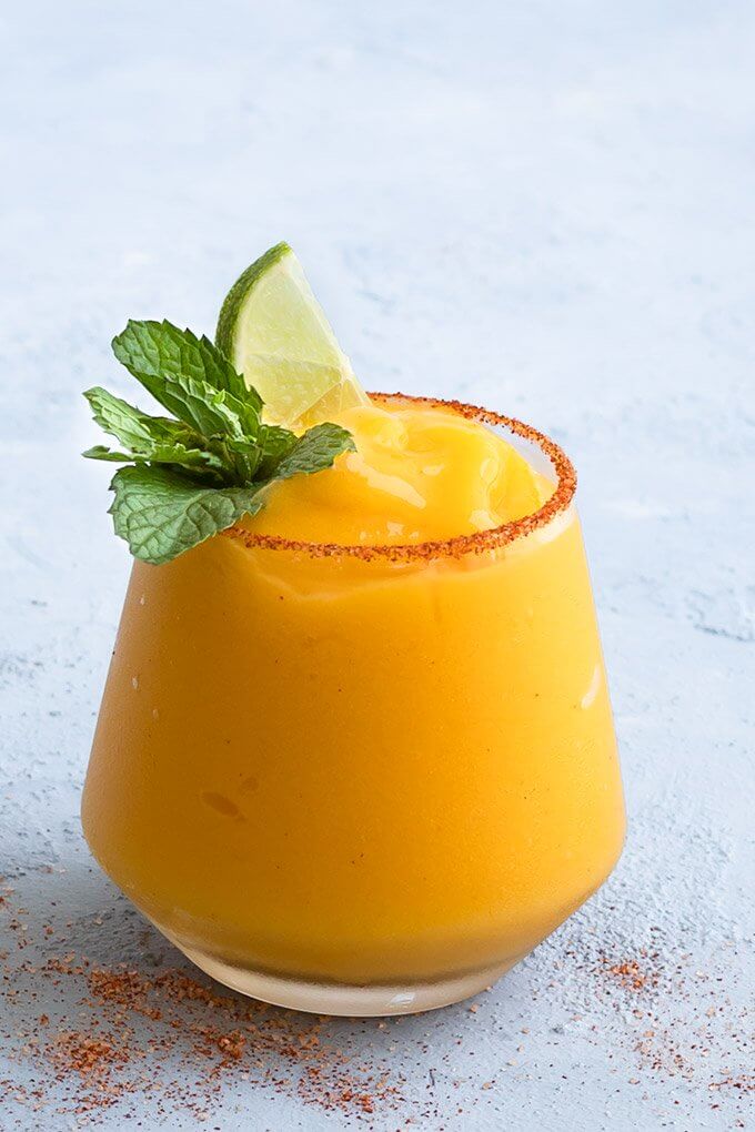 Frozen Mango Margarita get the full recipe on AS EASY AS APPLE PIE. These easy cocktail recipes are a refreshing treat to beat the heat this summer! Find mojito recipes, lemonade cocktails, Hawaiian mimosas, tequilas, and more!