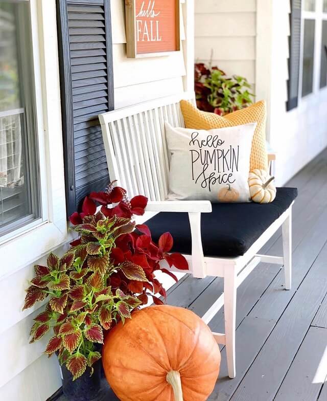 A refreshing fall front porch with a cute pillow cover