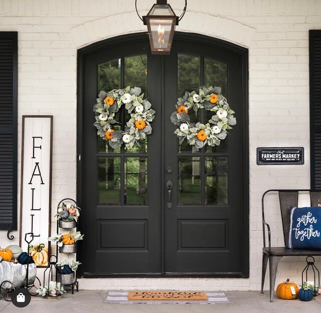 Fantastic fall wreaths and board sign on this gorgeous front door