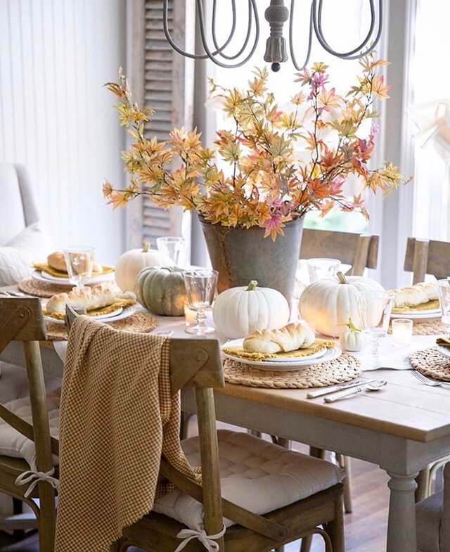 Adding candles and some warm tones make this fall tablescape so inviting. 