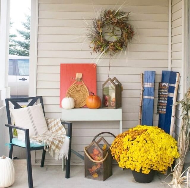 Adorable Fall Porch Ideas - easy and simple ways to make your front porch feel cozy and warm this autumn season!These fall porch ideas will show you how to easily create an autumn-ready porch using simple decors such as fall signs, wreaths, pumpkins, plants, and more! Image Via Ourhousenowahome