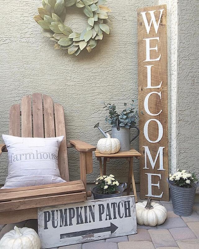 Adorable Fall Porch Ideas - easy and simple ways to make your front porch feel cozy and warm this autumn season!These fall porch ideas will show you how to easily create an autumn-ready porch using simple decors such as fall signs, wreaths, pumpkins, plants, and more! Image Via Rustedbliss