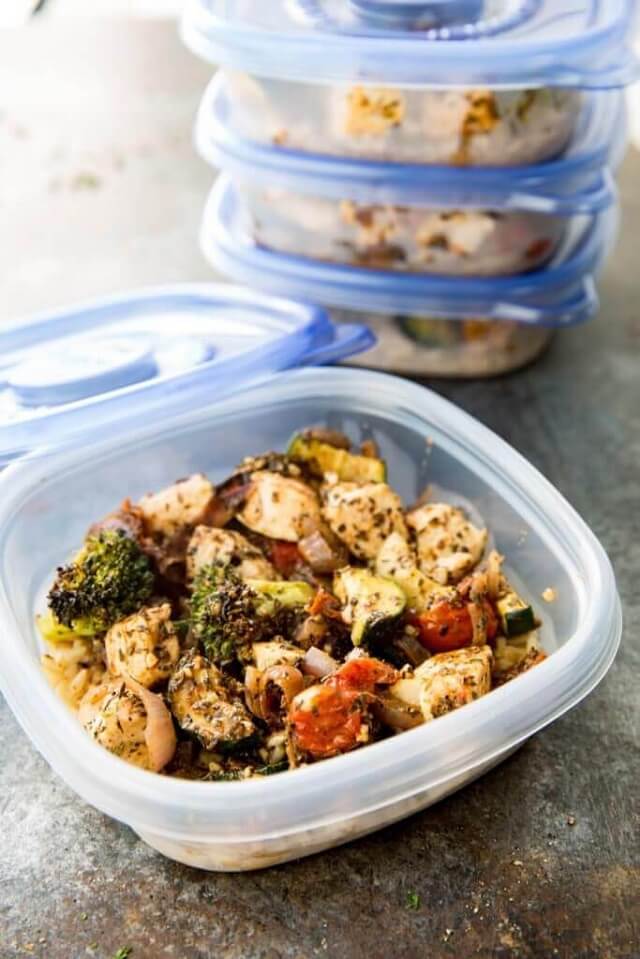 Brown rice, zucchini, broccoli, tomatoes, red onion, and deliciously seasoned chicken are all cooked on a sheet pan for a low mess, big flavor, and meal prep!