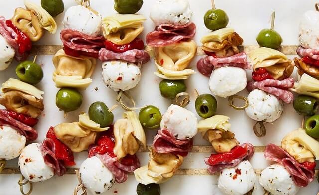 These stunning Easter appetizers are a great way to kick off the holiday season! Check out these eye-catching but easy Easter appetizers, including Peep Fruit Kabobs, meatballs, spring rolls, and more!