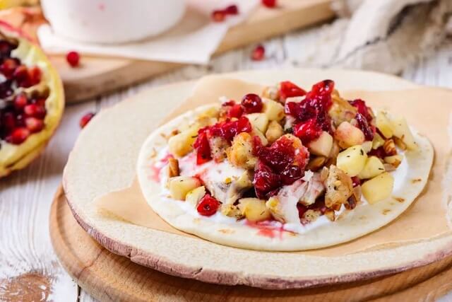 use pita bread and a homemade cranberry sauce laced with pomegranate molasses to give your leftover sandwich a Middle Eastern twist.