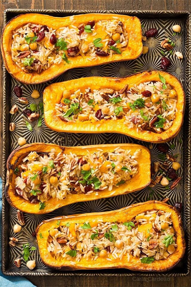 Are you looking for a filling vegan main course? Bake these Vegan Stuffed Butternut Squash with Cranberry Rice, Pecans, and Chickpeas as the main course for Thanksgiving!