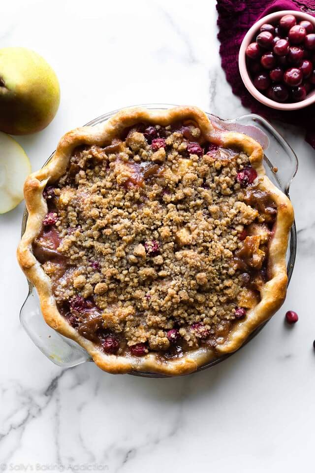 This irresistible cranberry pear crumble pie combines juicy pears, tart ruby red cranberries, and a buttery brown sugar topping.