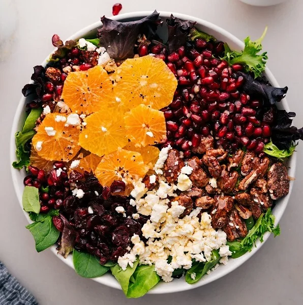 Try serving one of these Christmas salad recipes at your holiday gathering this year. They're bursting with holiday cheer and festive flavors like pomegranate seeds that are still juicy, citrusy dressings, and roasted vegetables.