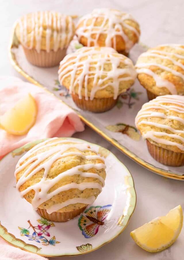 Lemon poppy seed muffins are moist and bursting with bright citrus flavor, and drizzled with a perfectly sweet lemon glaze.