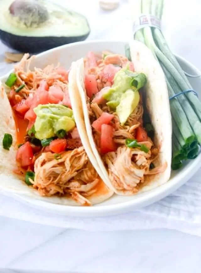 Only three ingredients are needed to make the chicken for these shredded chicken tacos: salsa, taco seasoning, and boneless, skinless chicken breasts.