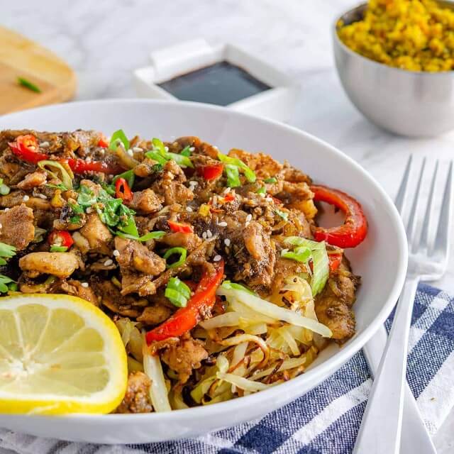 This recipe features unbelievably tender slices of pork shoulder that have been simmered and then stir-fried with onions, chilies, and peppers.