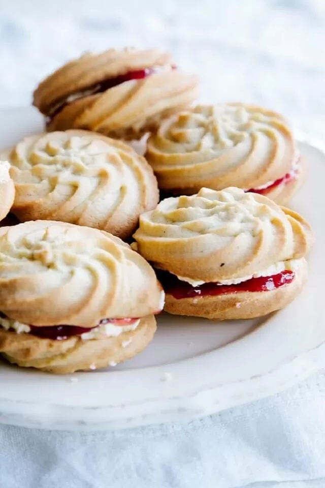 These elegant melt-in-your-mouth creations consist of two butter biscuits, sandwiched together with jam and buttercream.
