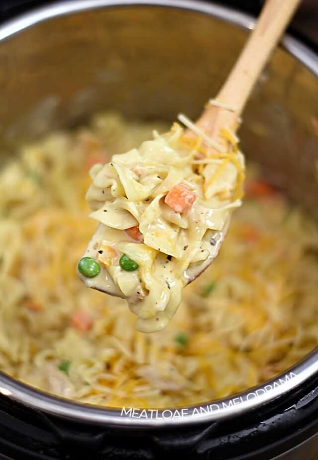 Imagine a medley of pasta, peas, and carrots all cuddled up in a velvety, cheesy sauce.