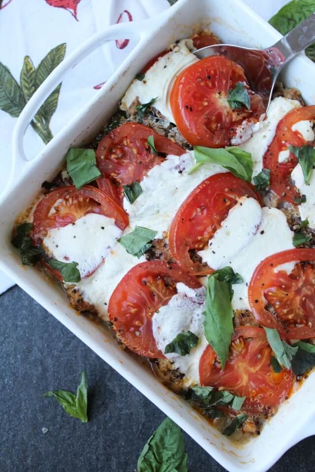 Think layers of quinoa, tomatoes, spicy Italian chicken, basil, and melted mozzarella. Delish!