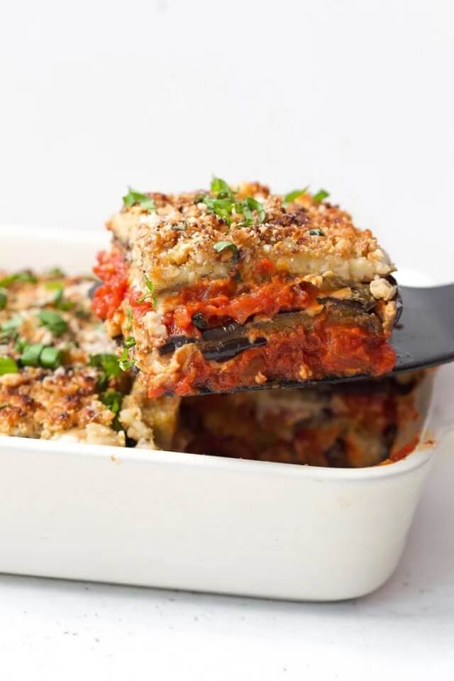 Imagine layers of cozy eggplant, a delightful tomato sauce, and a cashew-based "ricotta," all snuggled up and baked in the oven until it's all bubbly and wonderful.