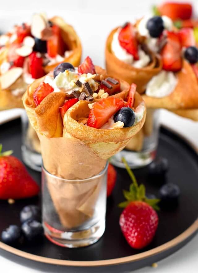 Rolled into a cone and filled with an assortment of fresh fruits, whipped cream, and sometimes even ice cream, these crepes are a burst of vibrant flavors that you'll find irresistible.