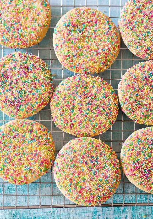 Also known as polvorones con chochitos or galletas de grageas, these traditional Mexican sugar sprinkle cookies are a sweet dessert staple found in bakeries all across Mexico.