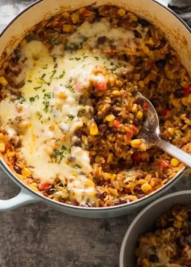 Loaded with corn, bell peppers, and black beans, and oozing with cheesy goodness, this rice casserole is a burst of vibrant Mexican flavors.