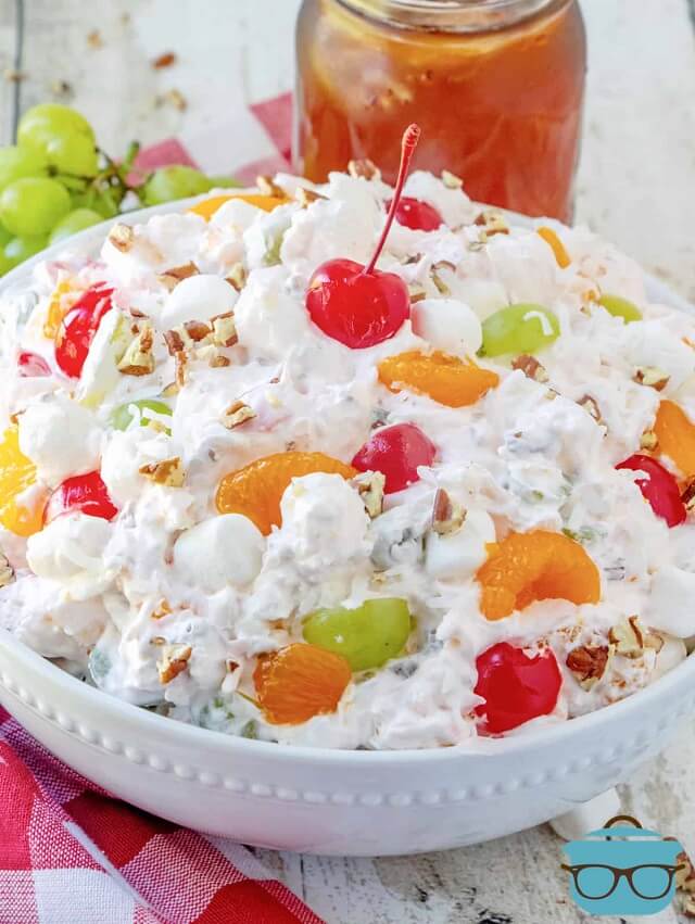 a classic crowd-pleaser made with Cool Whip, pineapple, grapes, mandarin oranges, cherries, and coconut flakes!