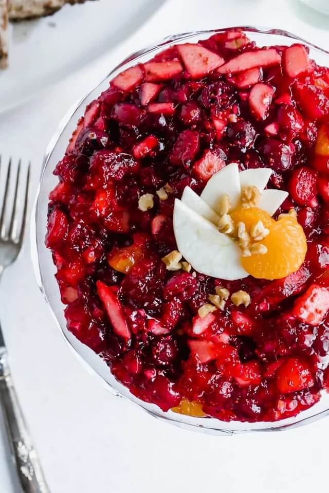 Cranberries, apples, pineapple, and mandarin oranges come together in raspberry Jello for a sweet side dish that’s part salad, part dessert, and all tradition!