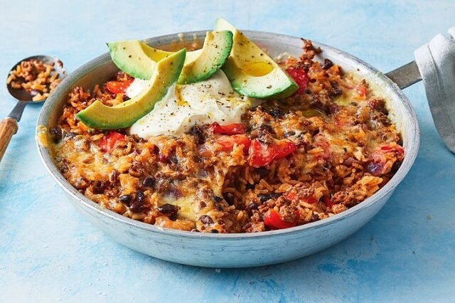 Ground turkey, black beans, salsa, and rice bake under a gooey cheese blanket.