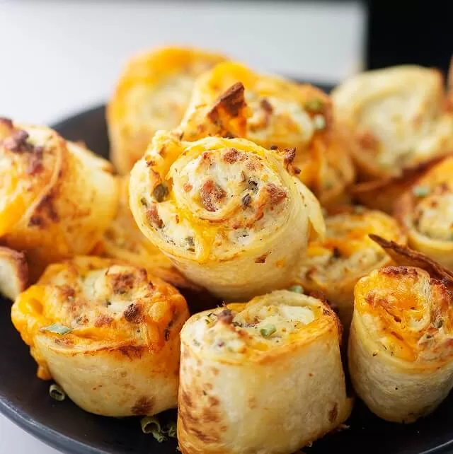 Find easy Game Day appetizers guests love, fast finger foods, crowd favorites, simple prep recipes perfect for parties and playoffs. Crack Chicken Pinwheels. Visit https://sharpaspirant.com