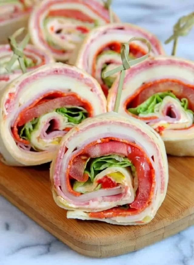 Find easy Game Day appetizers guests love, fast finger foods, crowd favorites, simple prep recipes perfect for parties and playoffs. Italian Sandwich Roll-Ups. Visit https://sharpaspirant.com