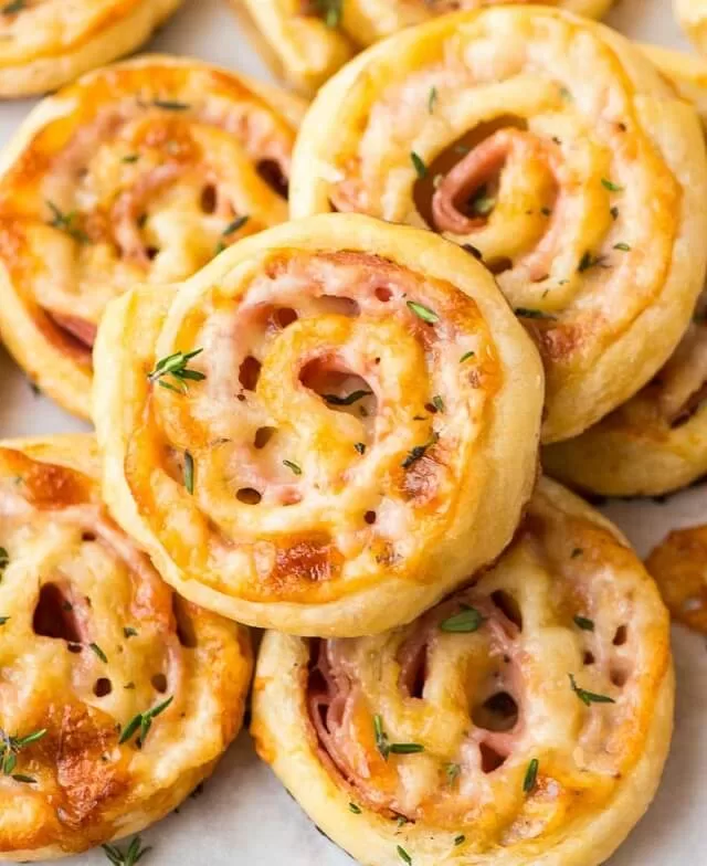 Find easy Game Day appetizers guests love, fast finger foods, crowd favorites, simple prep recipes perfect for parties and playoffs. Puff Pastry Ham & Cheese Pinwheels. Visit https://sharpaspirant.com