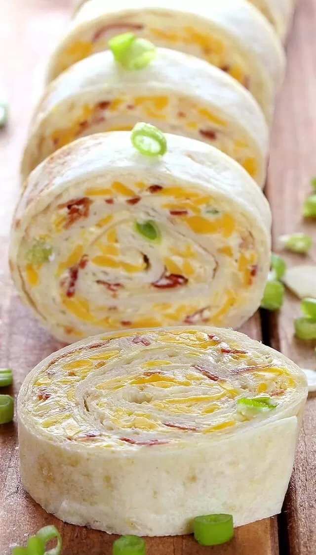 Find easy Game Day appetizers guests love, fast finger foods, crowd favorites, simple prep recipes perfect for parties and playoffs. Almond, Bacon & Cheddar Million Dollar Tortilla Roll-Ups. Visit https://sharpaspirant.com