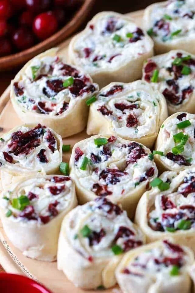 Find easy Game Day appetizers guests love, fast finger foods, crowd favorites, simple prep recipes perfect for parties and playoffs. Cranberry Feta Pinwheels. Visit https://sharpaspirant.com