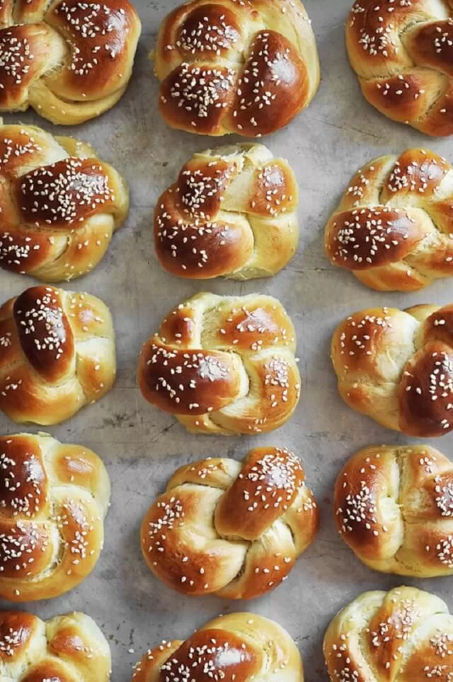 Mini challah rolls are soft, pillowy, and perfect for sliders or sandwiches. Serve them as a side or use them to hold pulled pork or ham. Visit https://sharpaspirant.com