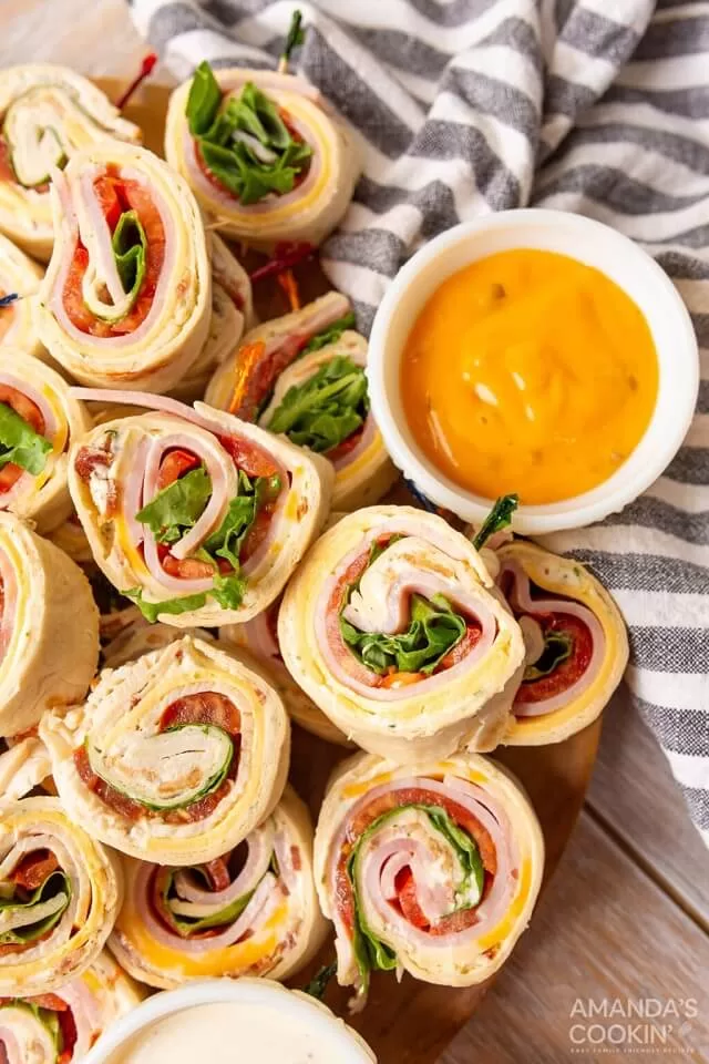 Pinwheel sandwiches are classic and endlessly customizable. Fill tortillas with ham, turkey, cheese, and fresh veggies. Visit https://sharpaspirant.com
