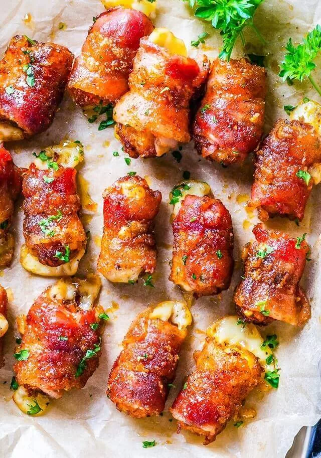 Sweet and spicy bacon bombs are bold, cheesy, and addictive. Tater tots and pepper jack cheese are wrapped in smoky bacon. Visit https://sharpaspirant.com