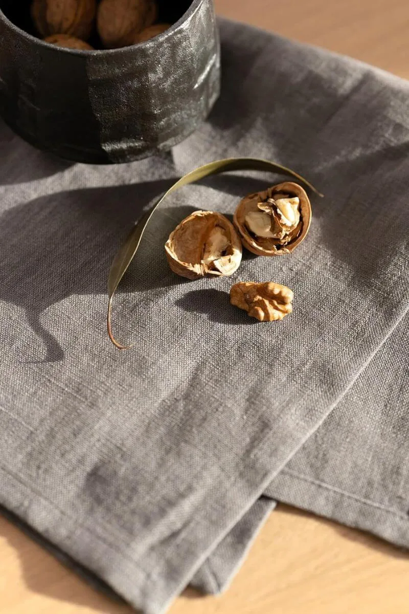 Soft French flax linen napkins with raw edges in a neutral fawn color for a relaxed spring lunch.
